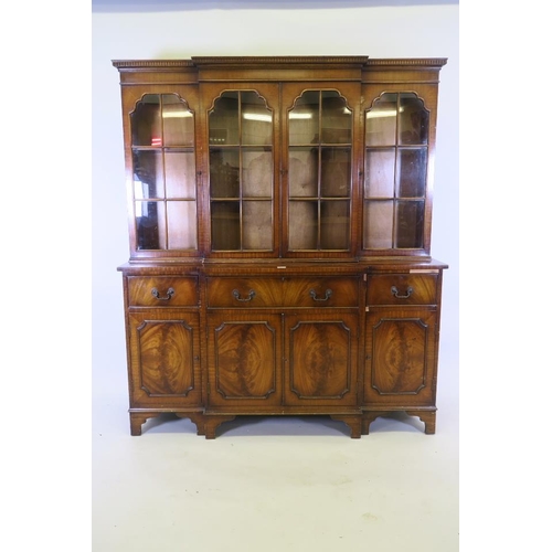 1234 - A small 'Jaycee' Regency style breakfront secretaire bookcase, the glazed upper section over two dra... 