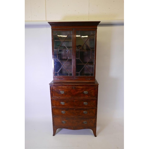 1236 - A George III mahogany secretaire bookcase, the upper section with dentil moulded cornice over two as... 