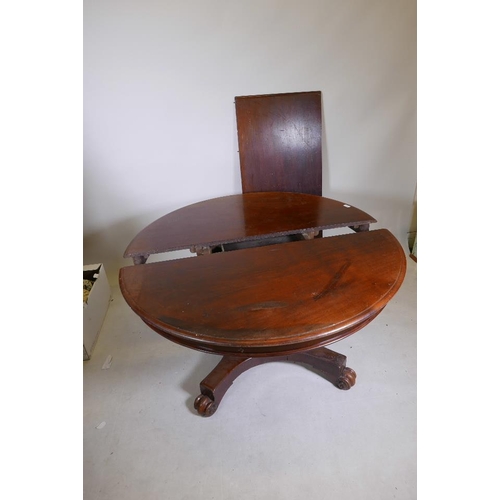 1237 - A C19th mahogany draw leaf dining table, raised on a shaped column and quadruple platform base with ... 