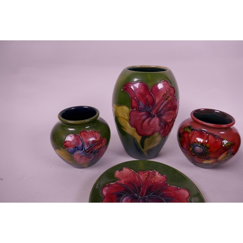 127 - Four small Moorcroft pottery vases and a matching saucer with floral decoration, largest 5