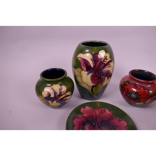 127 - Four small Moorcroft pottery vases and a matching saucer with floral decoration, largest 5