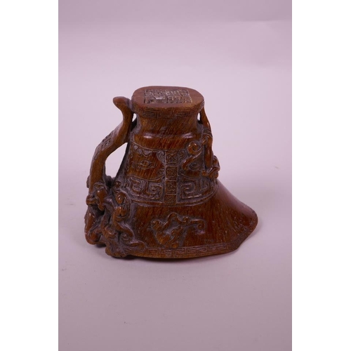 130 - A Chinese faux horn libation cup with carved kylin decoration, seal mark to base, 4½