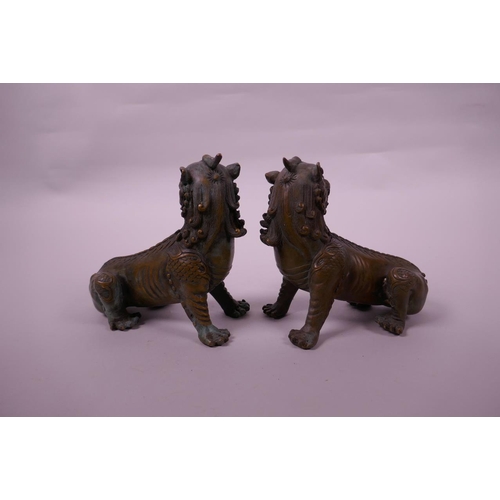 135 - A pair of Chinese bronze kylin scroll weights, 5½