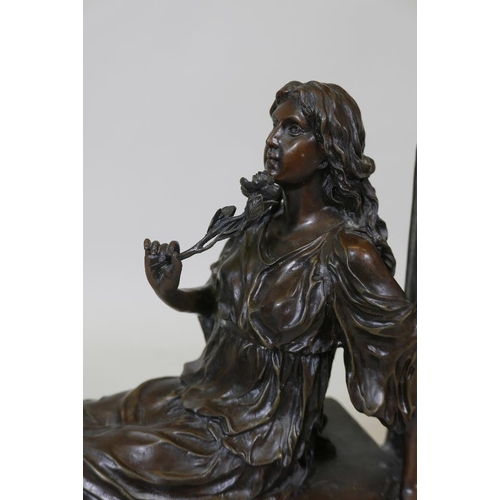 136 - A bronze figure of classical form, woman with a rose, 17