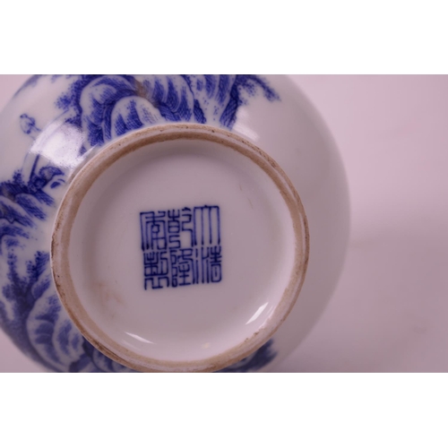 15 - A small Chinese blue and white porcelain bottle vase decorated with a mountain landscape, seal mark ... 