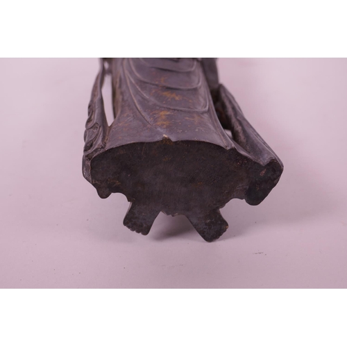 23 - A Chinese filled bronze figure of Quan Yin, 11