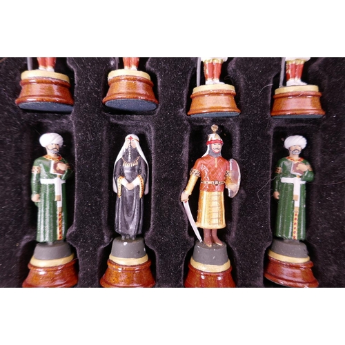 26 - A boxed chess set with cast metal hand painted figures of Crusaders and Saracens, kings 3