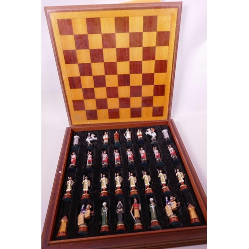 26 - A boxed chess set with cast metal hand painted figures of Crusaders and Saracens, kings 3