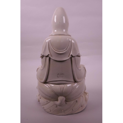 30 - A large Chinese blanc de chine Quan Yin, seated on a lotus flower, impressed seal marks verso, 16