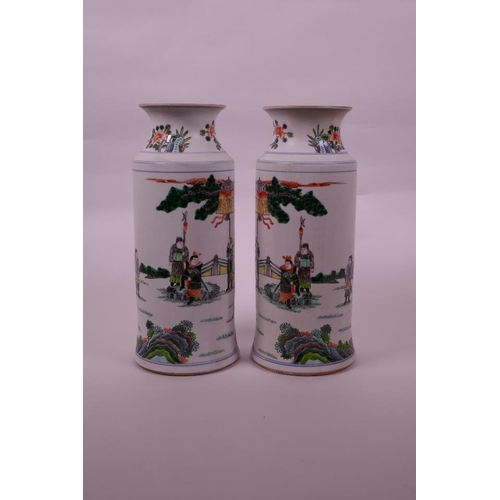 38 - A pair of Chinese famille verte porcelain cylinder vases decorated with warriors in a garden, 6 char... 