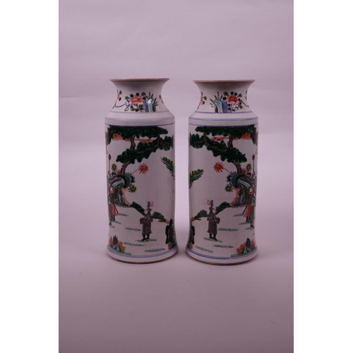 38 - A pair of Chinese famille verte porcelain cylinder vases decorated with warriors in a garden, 6 char... 