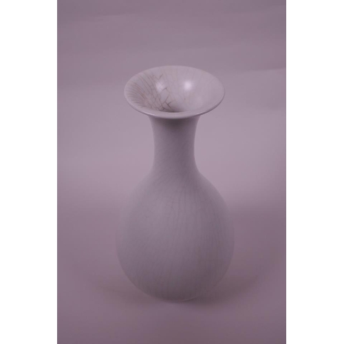 43 - A Chinese pear shaped porcelain vase with a white crackle glaze, 6 character mark to base, 10