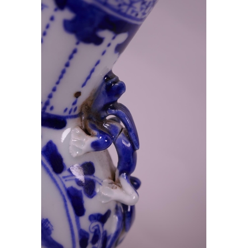 5 - A Chinese blue and white porcelain moon flask with two dragon handles and decorative panels depictin... 