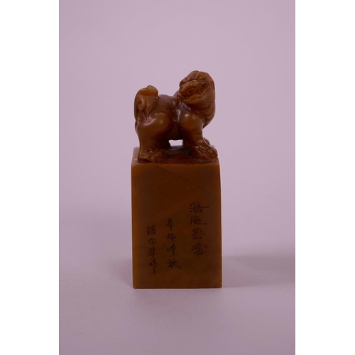 50 - A Chinese soapstone seal with a carved kylin knop and character inscription to side