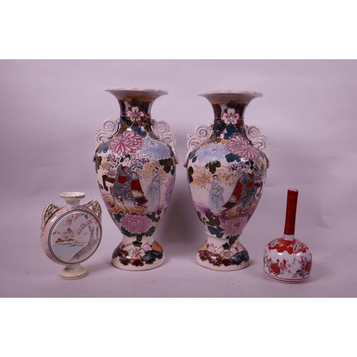 59 - A pair of Japanese Satsuma pottery two handled baluster vases decorated with figures in a garden, 12... 