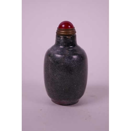 60 - A Chinese green hardstone snuff bottle with engraved and gilt character inscription, carved mark to ... 