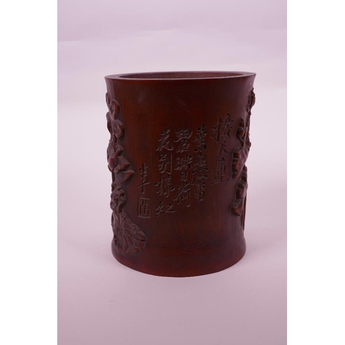 68 - A Chinese bamboo brush pot with carved lotus pond decoration, character inscription verso, 6½