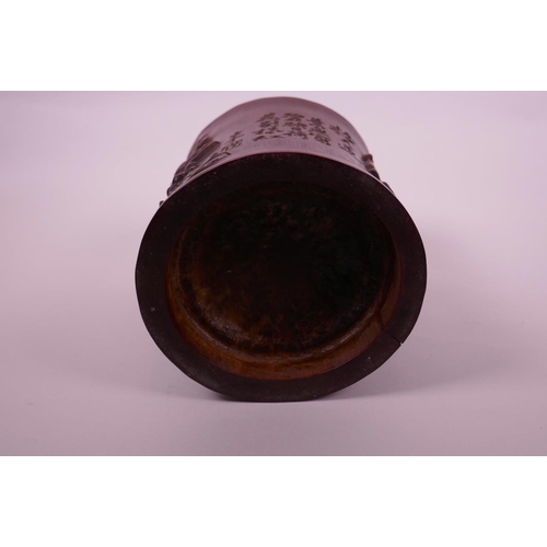 68 - A Chinese bamboo brush pot with carved lotus pond decoration, character inscription verso, 6½