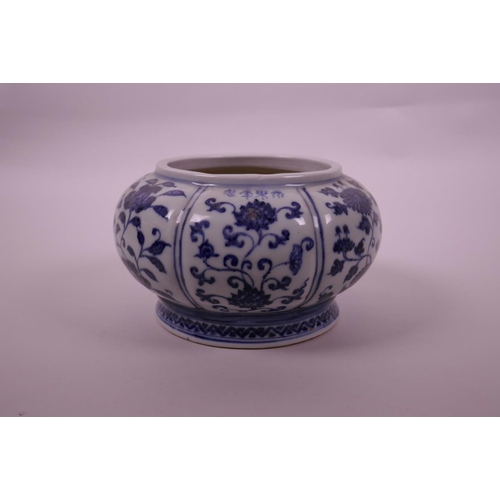 78 - A Chinese blue and white pottery bowl of lobed form, with decorative floral panels, 4 character mark... 