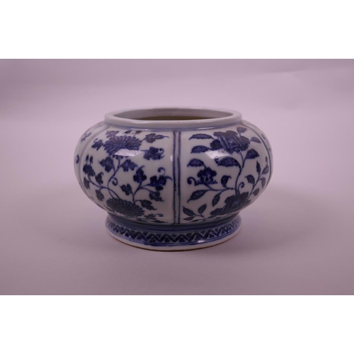 78 - A Chinese blue and white pottery bowl of lobed form, with decorative floral panels, 4 character mark... 