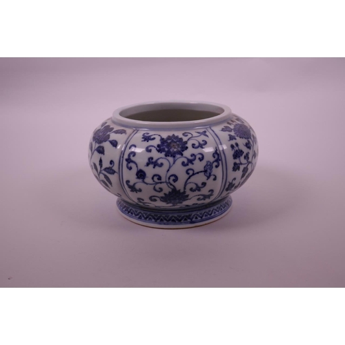 78 - A Chinese blue and white pottery bowl of lobed form, with decorative floral panels, 4 character mark... 