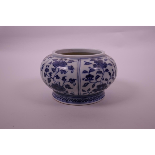 78 - A Chinese blue and white pottery bowl of lobed form, with decorative floral panels, 4 character mark... 