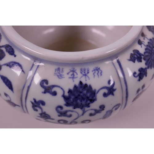 78 - A Chinese blue and white pottery bowl of lobed form, with decorative floral panels, 4 character mark... 