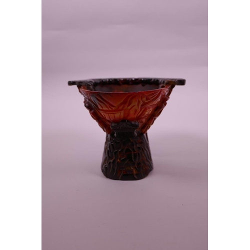 83 - A Chinese sectional horn and composition libation cup with carved decoration of figures in a landsca... 