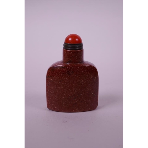 90 - A Chinese red goldstone snuff bottle, 2½