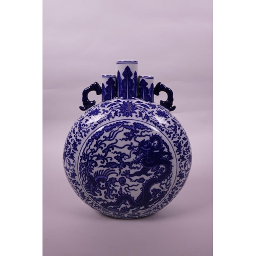 93 - A Chinese blue and white porcelain triple stem moon flask with two handles, decorated with a dragon ... 