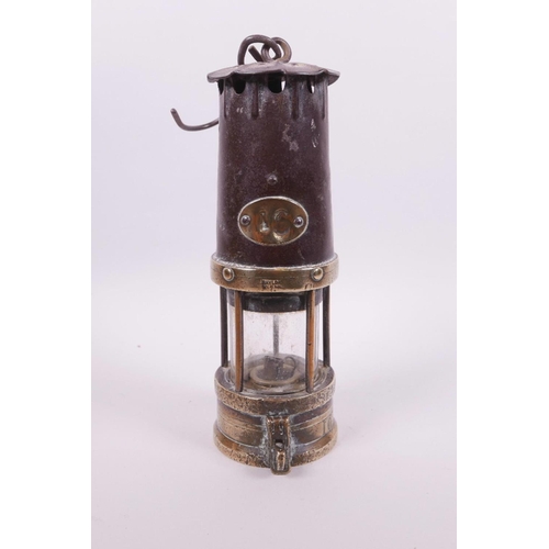 10 - An early miner's lamp with brass mounts and reservoir, by Naylor of Wigan, 10