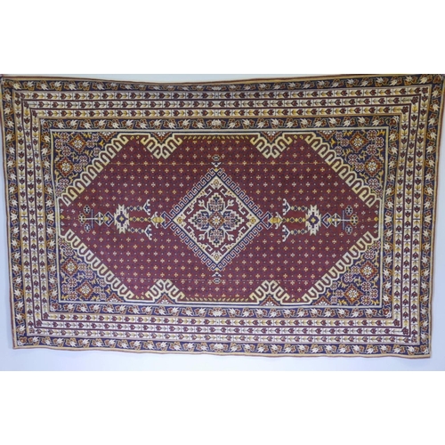 1201 - A Continental 'Oriental Pattern' wall hanging with central medallion surrounded by swastikas within ... 