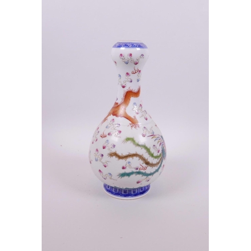 13 - A Chinese polychrome porcelain garlic head shaped vase decorated with a dragon and phoenix chasing t... 