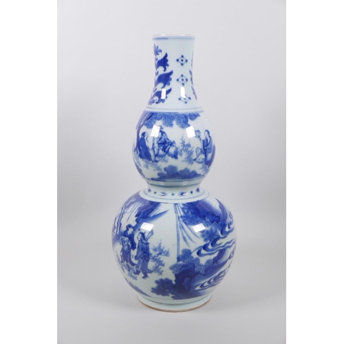 23 - A Chinese blue and white double gourd vase decorated with warriors and nobles in landscape scenes, 1... 