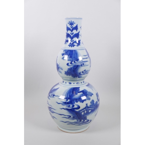 23 - A Chinese blue and white double gourd vase decorated with warriors and nobles in landscape scenes, 1... 