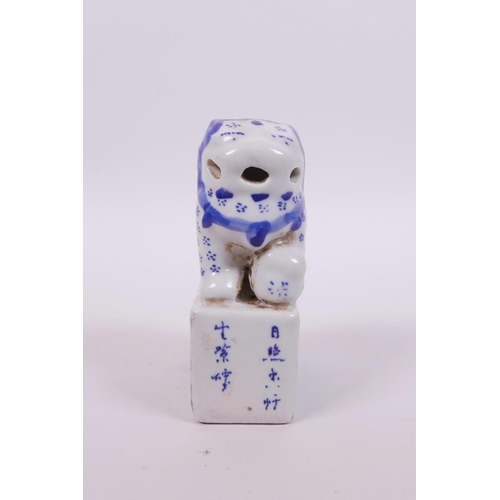 25 - A Chinese blue and white porcelain seal with a fo dog surmount and landscape decoration to side, 4