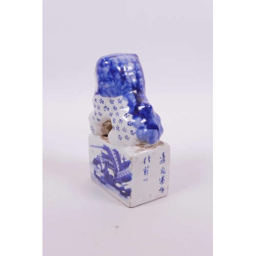 25 - A Chinese blue and white porcelain seal with a fo dog surmount and landscape decoration to side, 4