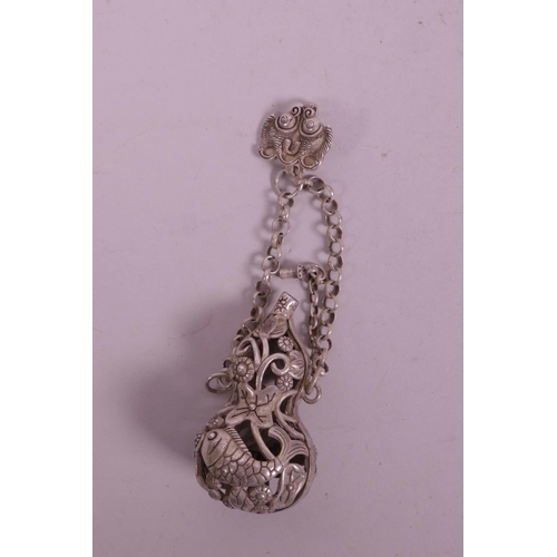 29 - A Chinese silvered metal pierced incense holder pendant in the form of a double gourd, 2½