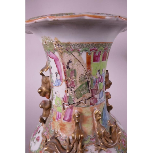 32 - A large Canton famille rose porcelain vase with gilt dragon handles, painted with panels of figures,... 