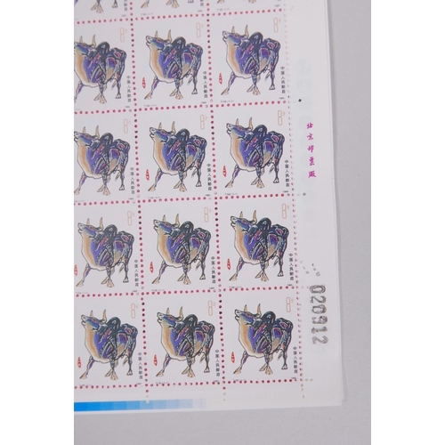 40 - A collection of six large facsimile (replica) Chinese perforated stamp sheets decorated with animals... 