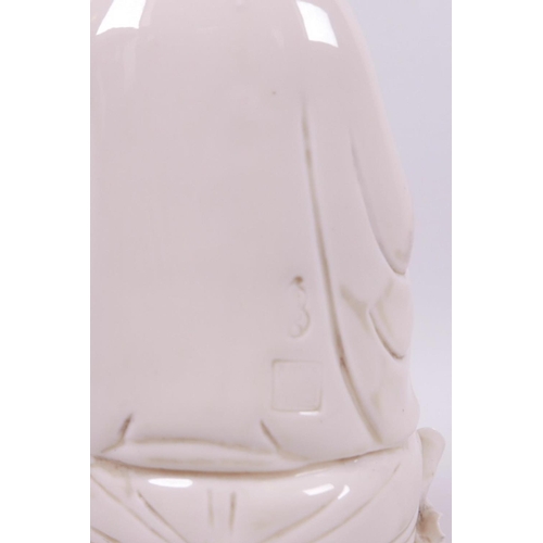 41 - A Chinese blanc de chine porcelain figure of Quan Yin, impressed marks verso, 10½