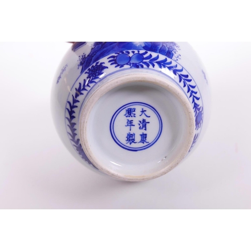 6 - A Chinese blue and white porcelain bottle vase decorated with travellers and children, 6 character m... 