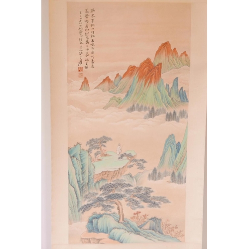 60 - A large Chinese watercolour scroll depicting a solitary figure in a mountain landscape, with gilt hi... 