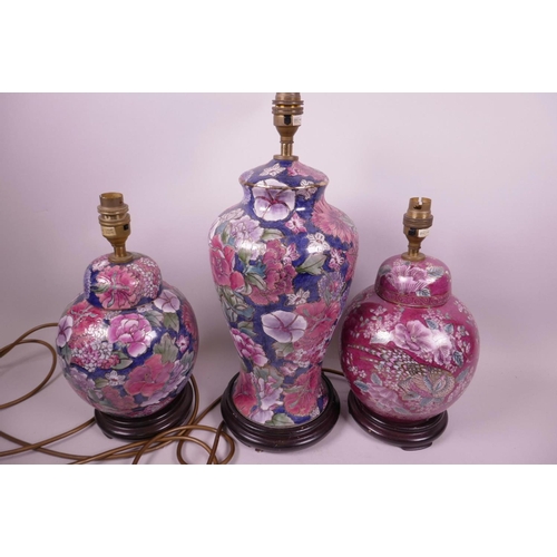 64 - Three Chinese porcelain table lamps in the form of a vase and two ginger jars with all over floral d... 