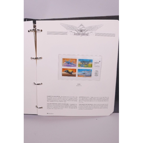 7 - An aviation heritage stamp collection album, and an album containing the 'Birds of the World' stamp ... 