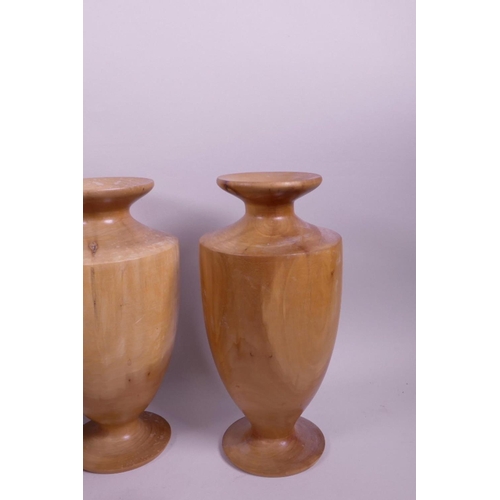 72 - A quantity of treen to include three turned vases, two small pots and covers and a Japanese rice bow... 