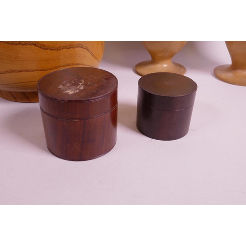 72 - A quantity of treen to include three turned vases, two small pots and covers and a Japanese rice bow... 