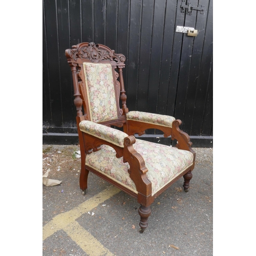 1207 - A pair of C19th walnut open armchairs with carved scroll and palm classical decoration, 44½