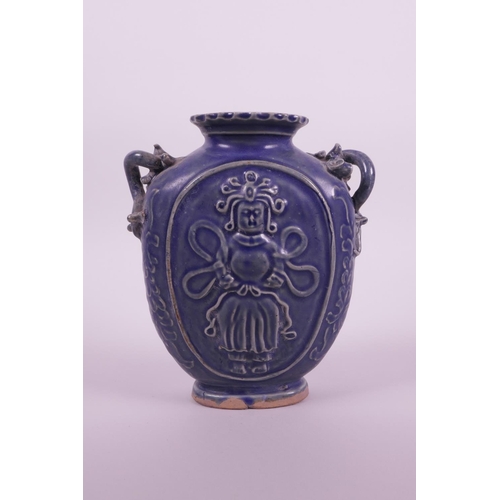 10 - A Chinese blue glazed pottery flask with two dragon shaped handles and raised decoration of an immor... 