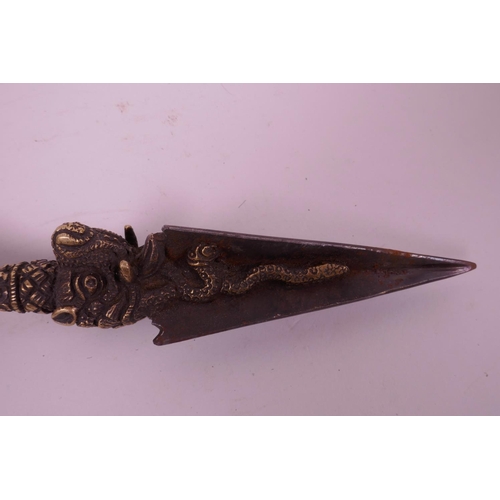 11 - A Sino-Tibetan bronzed metal ceremonial phurba, the handle decorated with a vajra, mythical creature... 